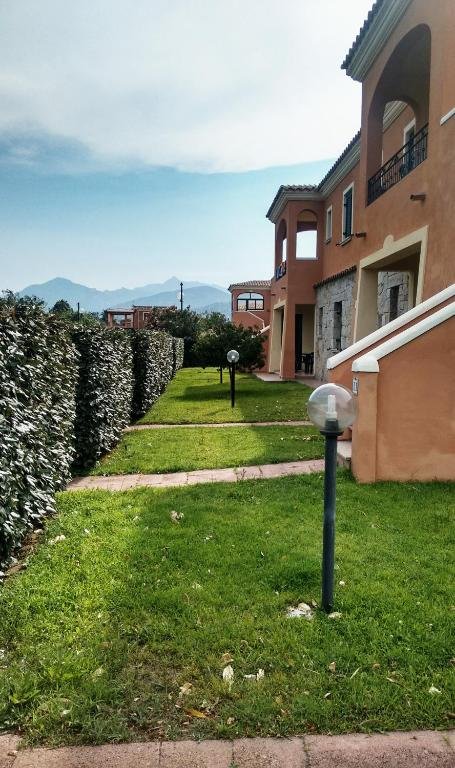 Gardens and mountain view at Residence Edilmare San Teodoro